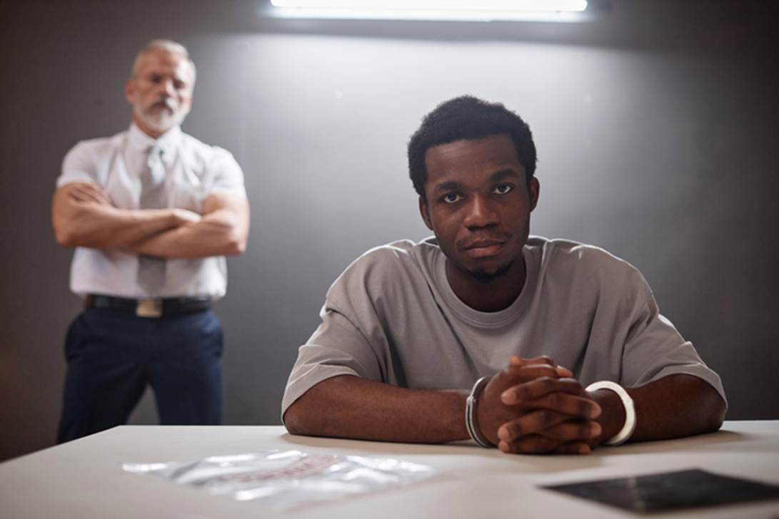 A person sitting at a table with his arms crossed
AI-generated content may be incorrect.